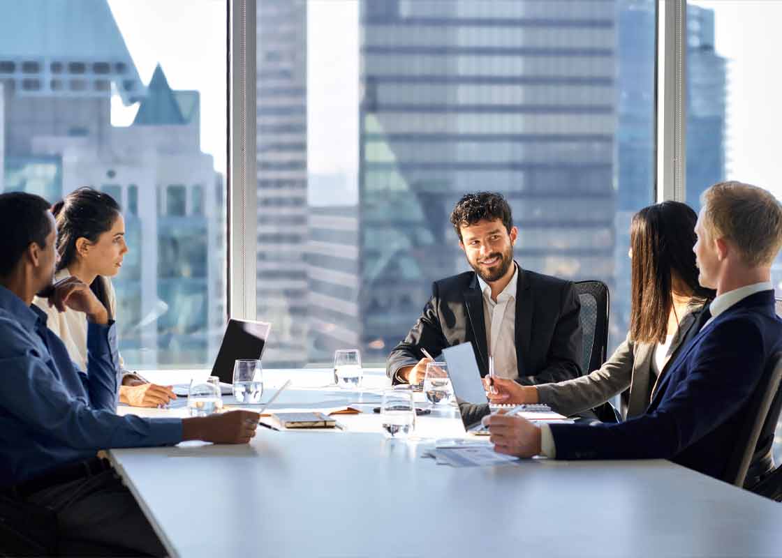 Enterprise team in office building meeting.